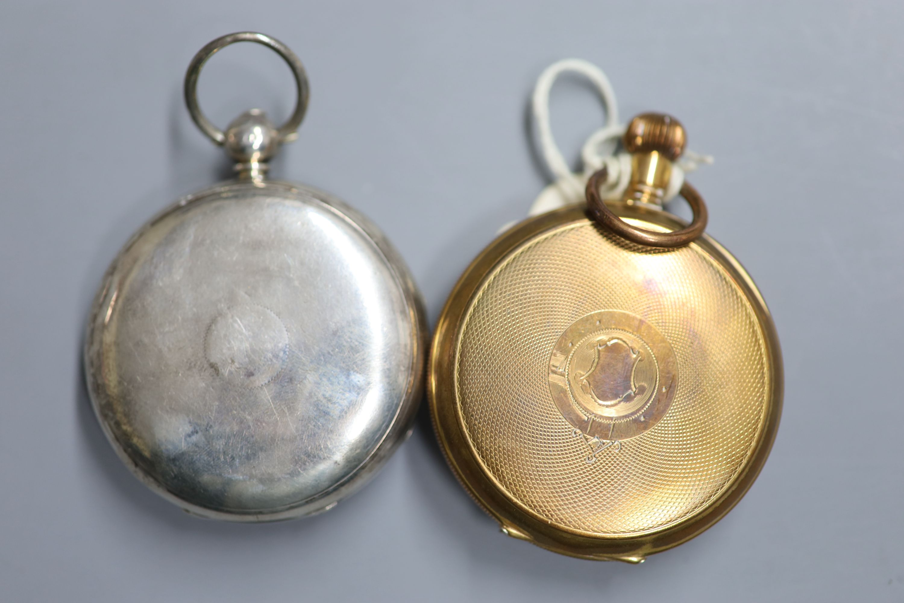 An engine turned gold plated half hunter keyless pocket watch and a 19th century silver pocket watch